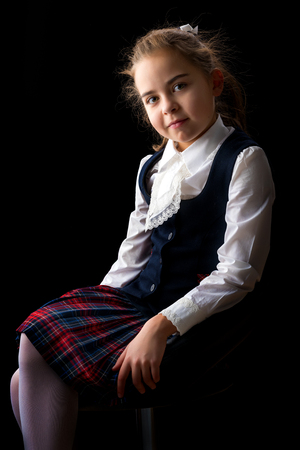 Little girl on a black backgroundの写真素材