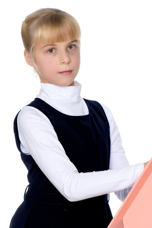 Little girl is playing with wooden houses.の写真素材