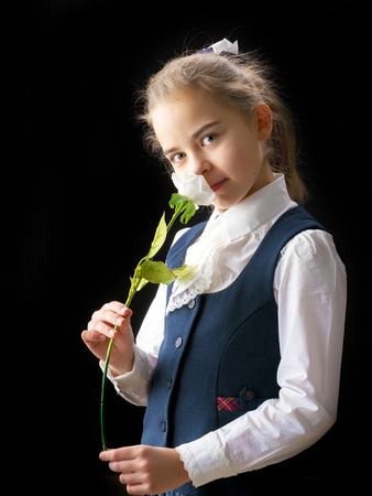 Little girl with a flower in her hand.の写真素材