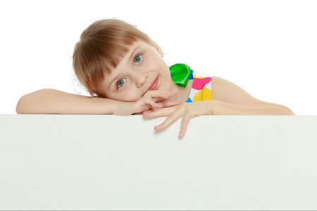 Girls looks because of the white obstacle.の写真素材