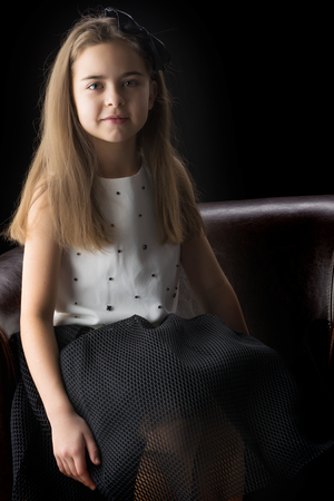 Little girl on a black backgroundの写真素材