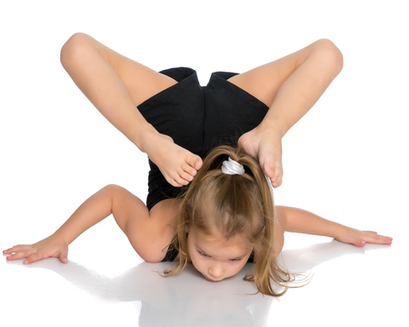The gymnast perform an acrobatic element on the floor.の写真素材