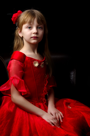 Little girl on a black backgroundの写真素材