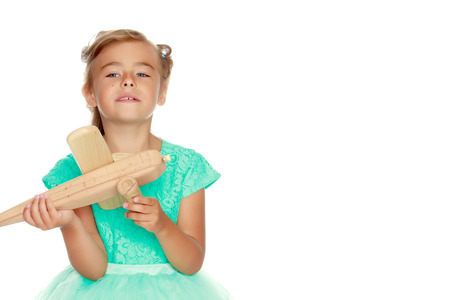 Little girl with a plane in her hand.の写真素材