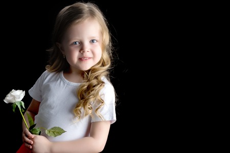 Little girl with a flower in her hand.の写真素材