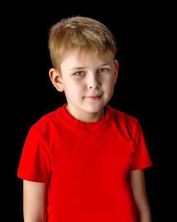 Little boy on a black background.の写真素材