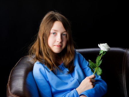 Little girl with a flower in her hand.の写真素材
