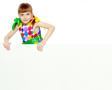 Girls looks because of the white obstacle.の写真素材