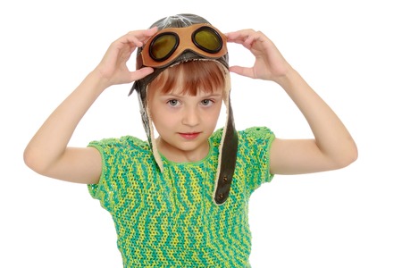 Little girl in the cap of the pilotの写真素材