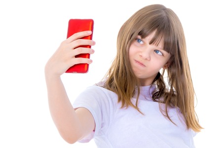 cute little girl making selfieの写真素材