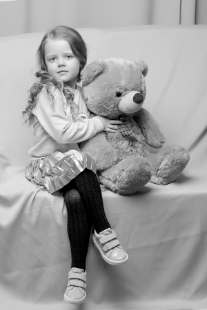 Little girl with teddy bearの写真素材