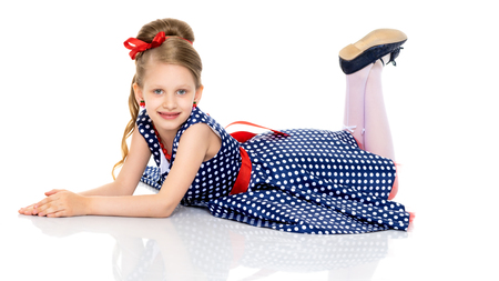Little girl lies on the floorの写真素材