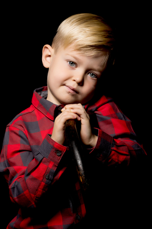 Little boy on a black background.の写真素材