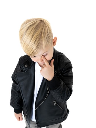 Little boy touches the eyeの写真素材