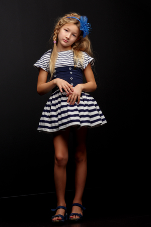 Little girl on a black backgroundの写真素材