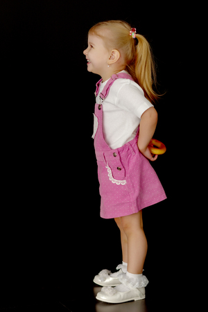 Little girl on a black backgroundの写真素材