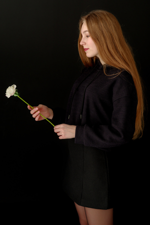 Little girl with a flower in her hand.の写真素材