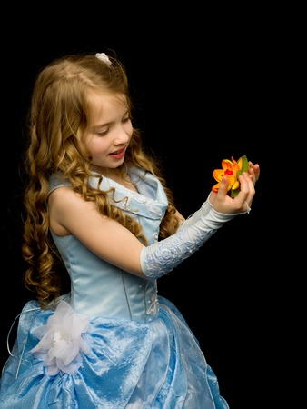 Little girl on a black backgroundの写真素材
