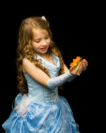 Little girl on a black backgroundの写真素材