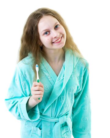 A little girl brushes her teeth.Isolated on white background.の写真素材