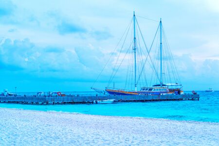 Yacht near the pier of a fabulous island in the Maldives.の写真素材