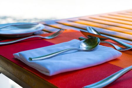 Beach restaurant with sea views, glasses, plates, food, dishesの写真素材