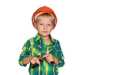The little boy in the helmet of the builder.の写真素材