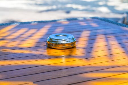 View of Park Table with Metal Ashtray in a Sunny Dayの写真素材