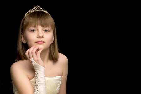 The little girl folded her hands around her face.の写真素材