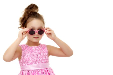 Little girl in sunglasses.Isolated on white background.の写真素材