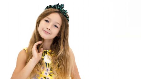 A little girl in a long, elegant dress of a princess.の写真素材