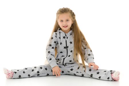 Little girl schoolgirl, performs gymnastic twine.の写真素材