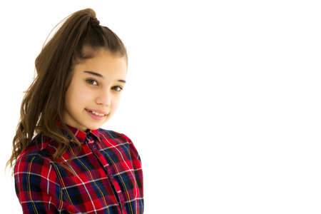 Beautiful little girl close-up. The concept of beauty and fashion, happy childhood. Isolated on white background.の写真素材