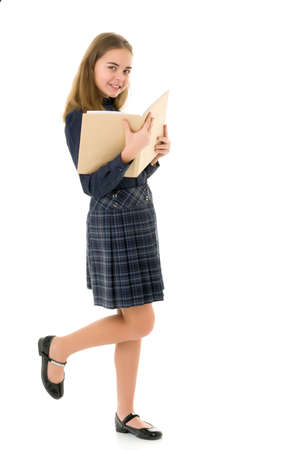 Girl schoolgirl with book.Isolated on white background.の写真素材