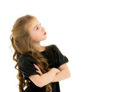 The little girl looks up.The concept of childrens emotions.の写真素材