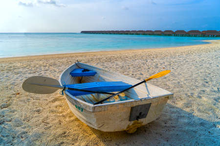 View of nice tropical beach with old boat