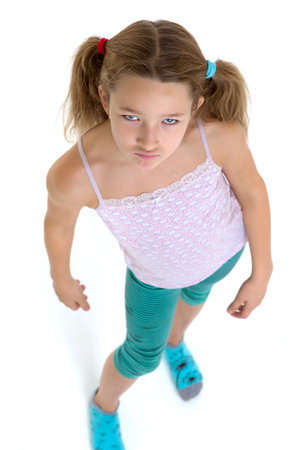 Preteen girl looking up at cameraの写真素材