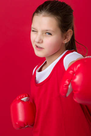 Teenage girl posing in boxing glovesの写真素材