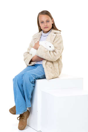 Stylish girl holding white rabbitの写真素材