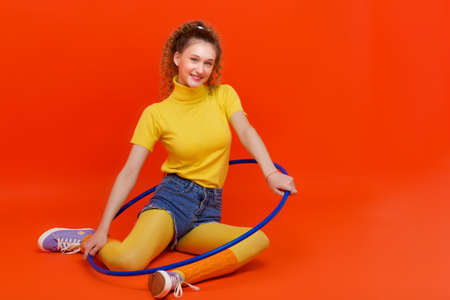 Happy fitness girl doing exercises with  hoopの写真素材