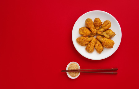 Fresh fried chicken on a white plate. Top view, flat lay, copy space.の写真素材