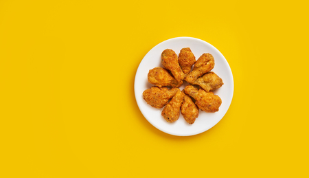 Fresh fried chicken on a white plate. Top view, flat lay, copy space.の写真素材