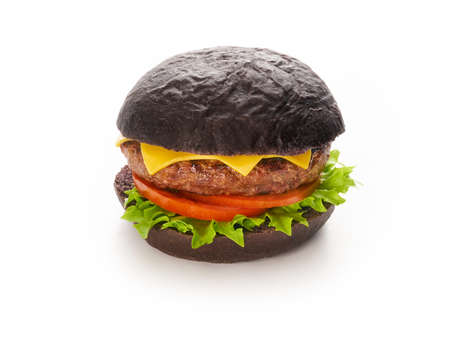 Black burger with beef meat cheese lettuce onion, tomato isolated on a white background, fast food and take away delivery conceptの写真素材