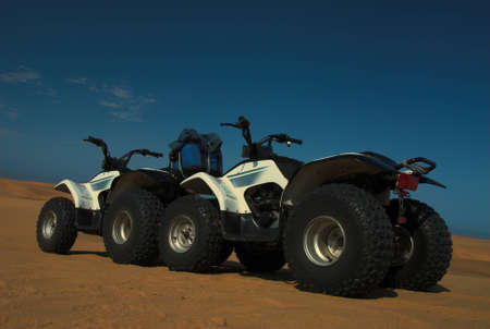 Two quad bikes (all terrain vehicles) in Namib desertの写真素材