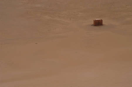 Looking down from the top of red sand dunes towards an outdoor bathroom, Namib desert, Namibiaの写真素材