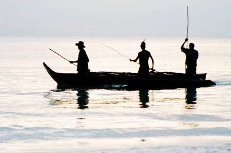 Sunrise fishing on Zanzibar Island off the coast of Tanzania, Africaの写真素材