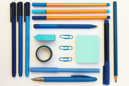 A flat lay of blue school stationery on a white background.の写真素材