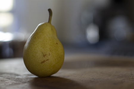 Pear on bench top small depth of fieldの写真素材