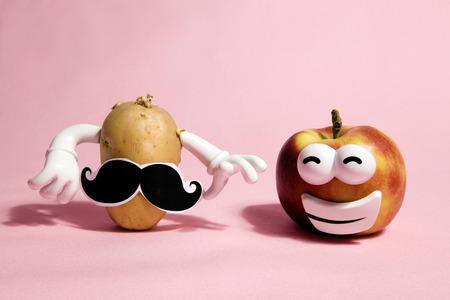 a pop and minimal potato portrait on a pink backgroundの写真素材