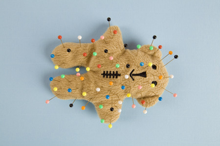 a quirky teddy bear like a voodoo doll isolatedの写真素材